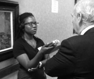 Generation Justice Alumna Jonquilyn Hill conducts an audio interview at the NM KIDS COUNT Conference.